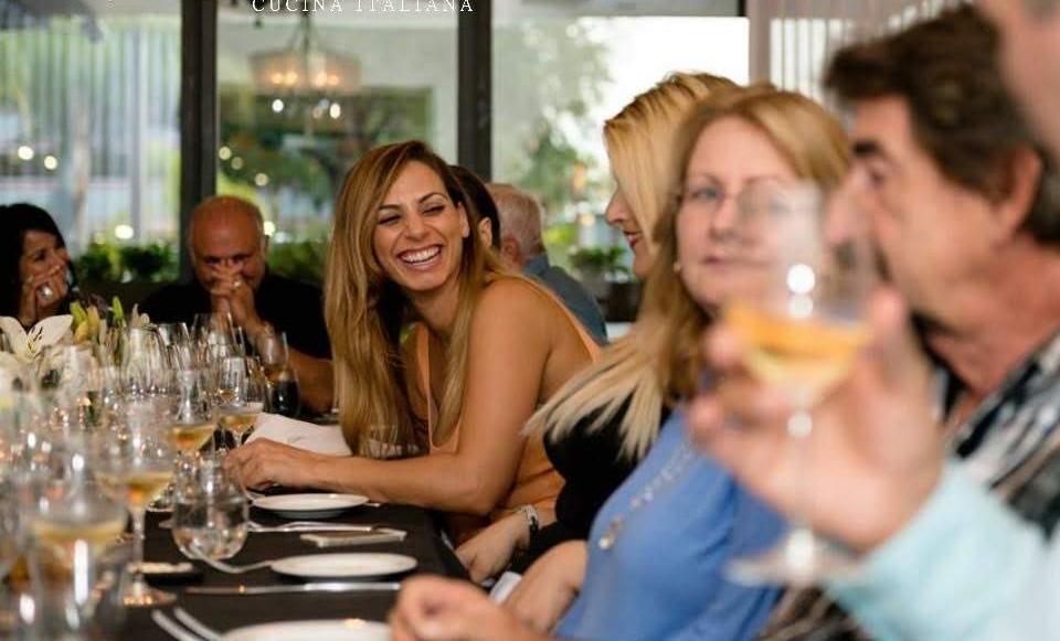 Guests laughing at private event dinner