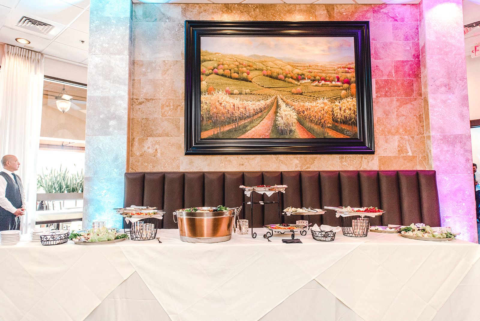Buffet display with Italian painting and uplighting